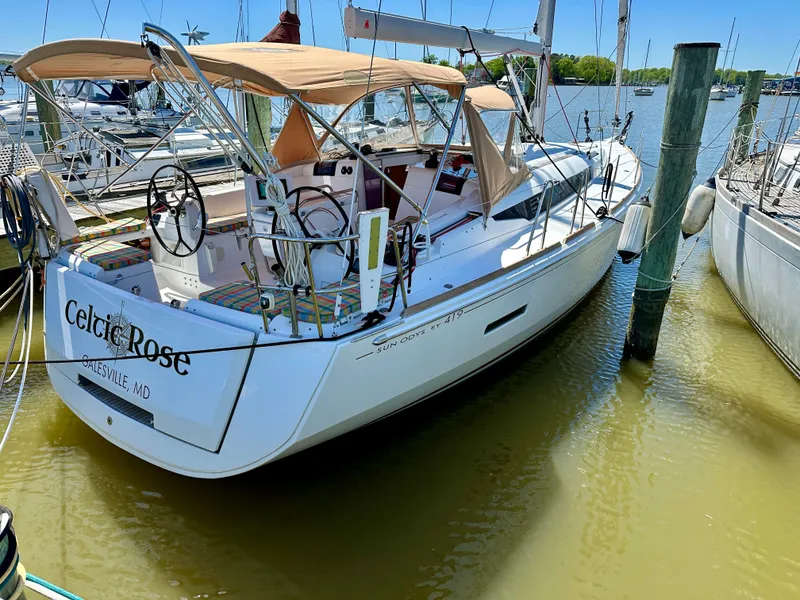 Slide: The Image of 2018 Jeanneau Sun Odyssey 419 sailboat docked in a marina. - 9