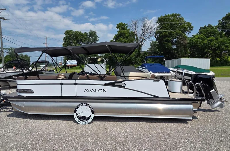 The Image of 2025 Avalon Platinum Catalina 2385 Elite pontoon boat with canopy, parked outdoors. - 0