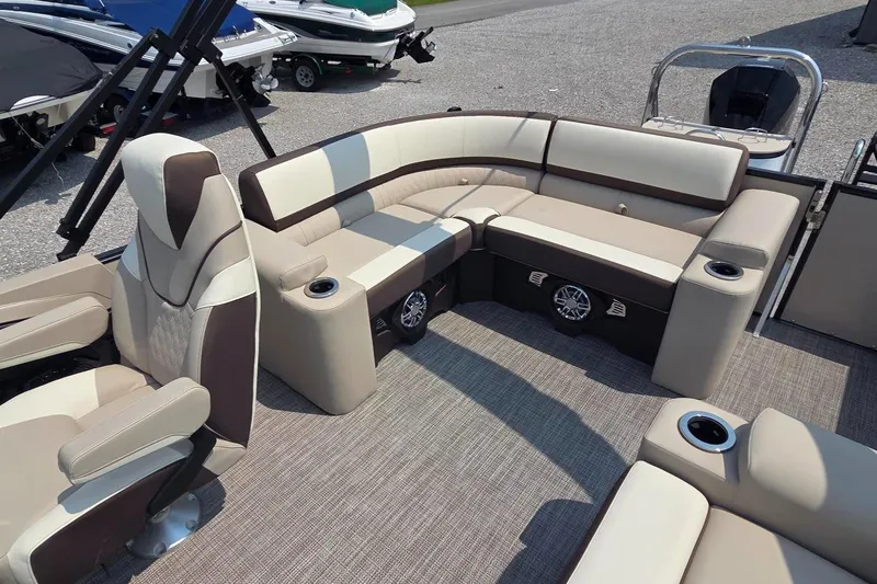 Slide: The Image of Luxurious seating on 2025 Avalon Platinum Catalina 2385 Elite pontoon boat, featuring cup holders and speakers. - 10