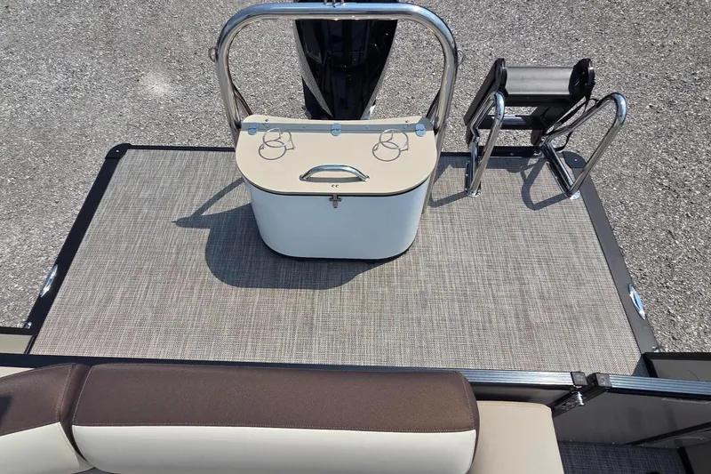 Slide: The Image of 2025 Avalon Platinum Catalina 2385 Elite boat deck with seating and storage. - 11
