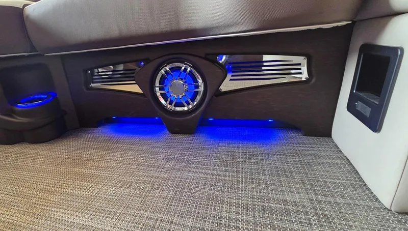 Slide: The Image of 2025 Avalon Platinum Catalina 2385 Elite interior with blue LED lighting and modern speaker design. - 14