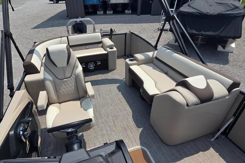 Slide: The Image of 2025 Avalon Platinum Catalina 2385 Elite boat interior with luxurious seating and modern design. - 7
