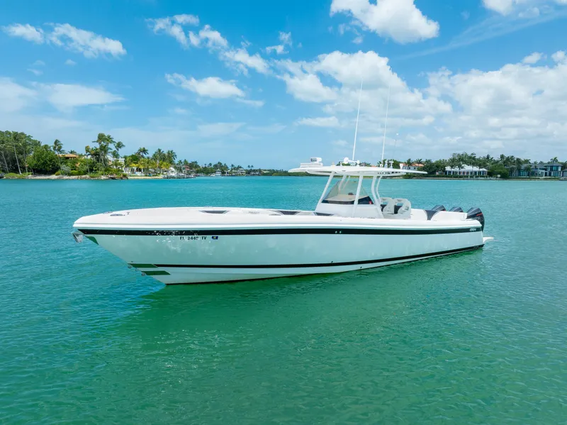 Slide: The Image of 2018 Intrepid 375 Open boat on clear blue water under a sunny sky. - 0