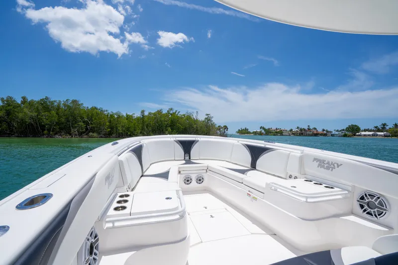 Slide: The Image of 2018 Intrepid 375 Open boat with spacious seating, cruising on a sunny day. - 25
