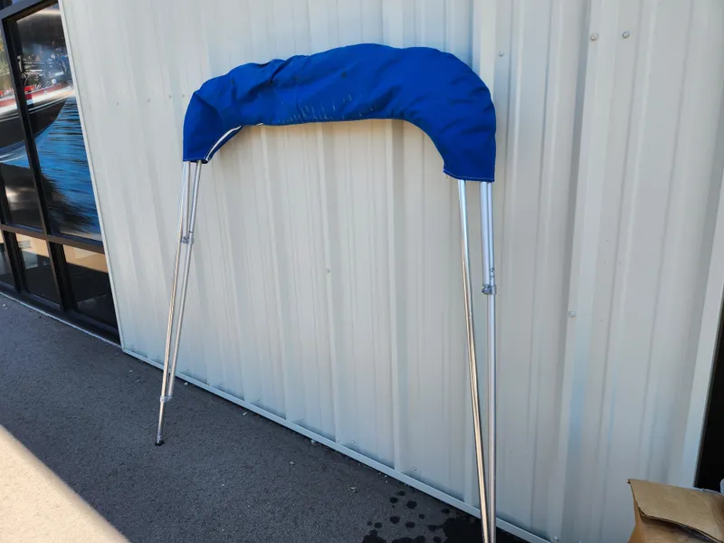 Slide: The Image of Blue bimini top for 1985 Boston Whaler 15, leaning against a wall. - 10