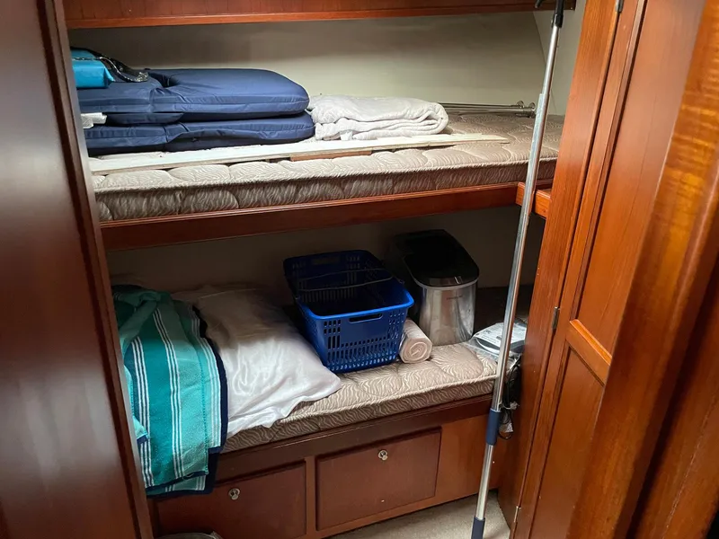 Slide: The Image of 1986 Egg Harbor 41 Convertible cabin with bunk beds and storage. - 12