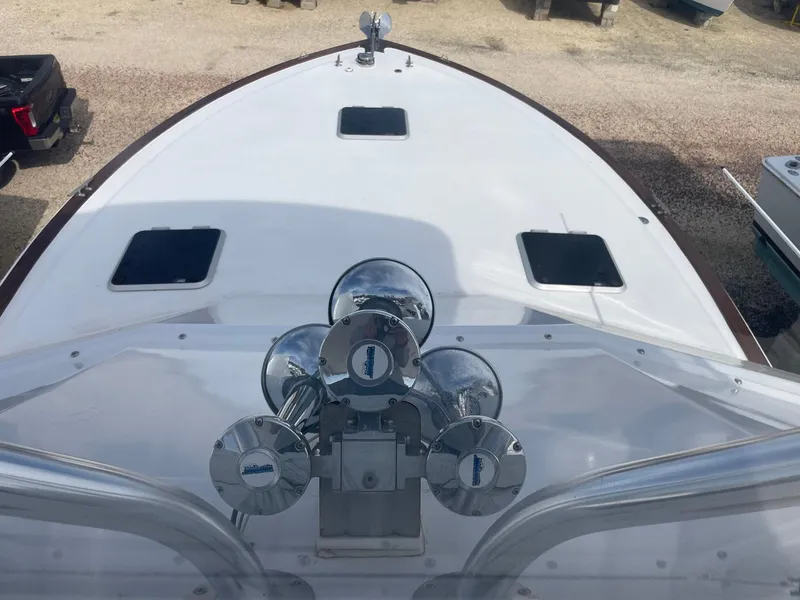 Slide: The Image of 1986 Egg Harbor 41 Convertible boat deck with chrome fixtures and hatches. - 13