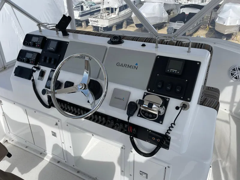 Slide: The Image of Control panel of a 1986 Egg Harbor 41 Convertible boat with Garmin navigation system. - 14