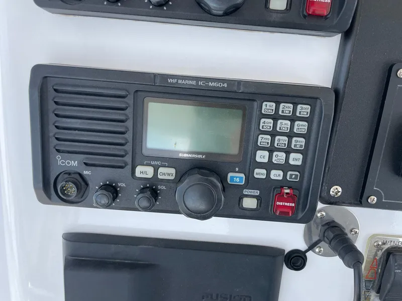 Slide: The Image of VHF marine radio on 1986 Egg Harbor 41 Convertible boat dashboard. - 19