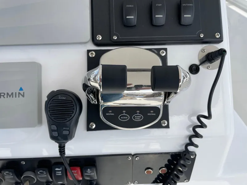 Slide: The Image of Control panel of a 1986 Egg Harbor 41 Convertible boat with throttle and microphone. - 22