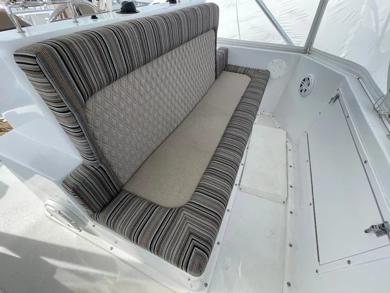 Slide: The Image of 1986 Egg Harbor 41 Convertible boat interior with striped cushioned seating. - 25