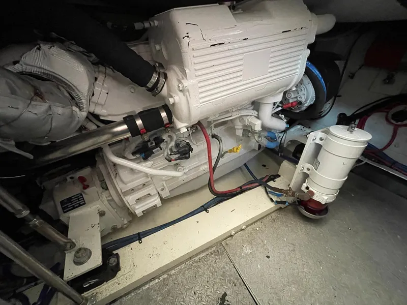 Slide: The Image of Engine room of 1986 Egg Harbor 41 Convertible boat, showcasing mechanical components. - 26