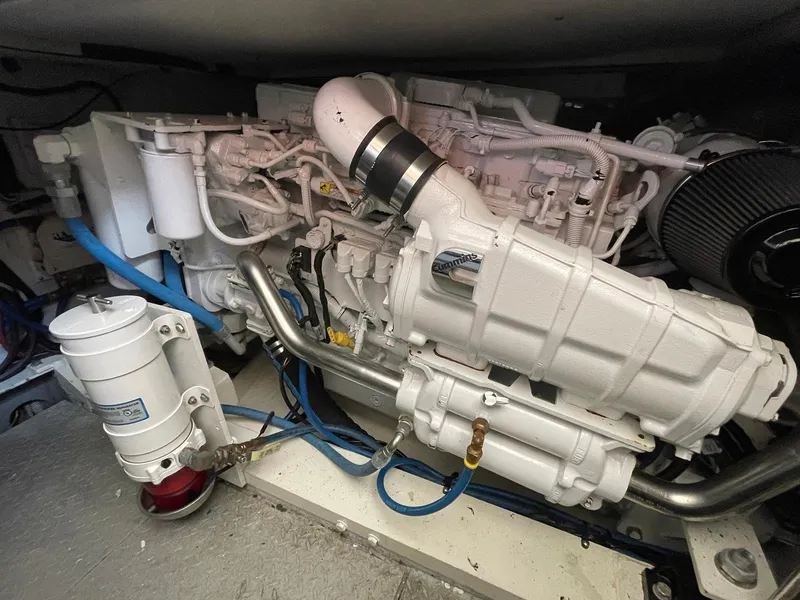 Slide: The Image of Engine compartment of a 1986 Egg Harbor 41 Convertible boat, showcasing detailed mechanical components. - 28