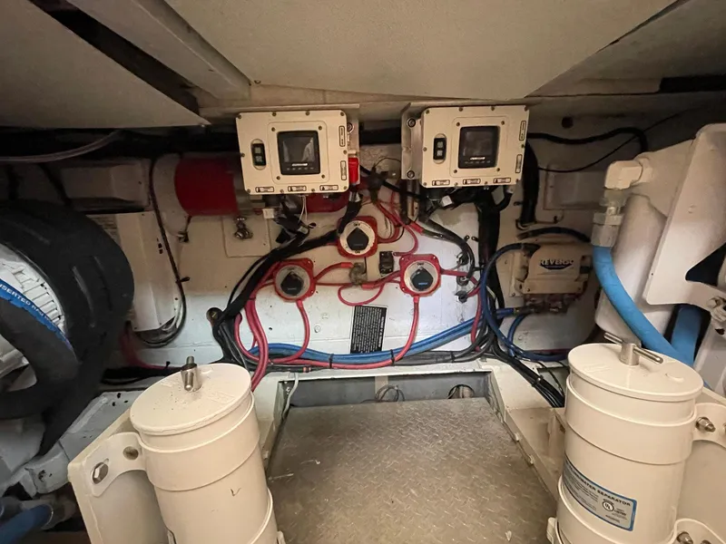 Slide: The Image of Engine room of 1986 Egg Harbor 41 Convertible with wiring and control panels. - 29