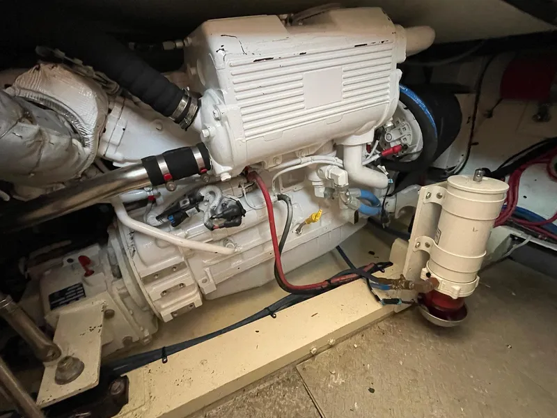 Slide: The Image of Engine room of a 1986 Egg Harbor 41 Convertible boat, showcasing mechanical components. - 30