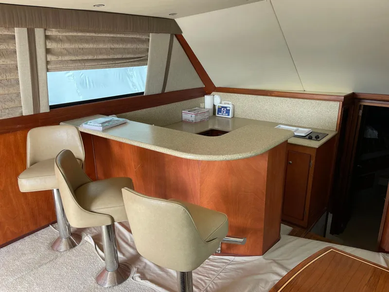 Slide: The Image of Interior of 1986 Egg Harbor 41 Convertible yacht with bar and seating area. - 4