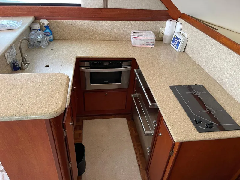 Slide: The Image of 1986 Egg Harbor 41 Convertible yacht kitchen with stove, oven, and countertop. - 6