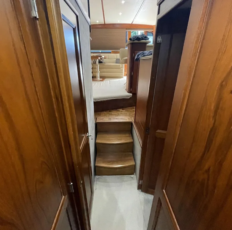 Slide: The Image of Interior of 1986 Egg Harbor 41 Convertible yacht with wooden stairs and cozy cabin. - 8