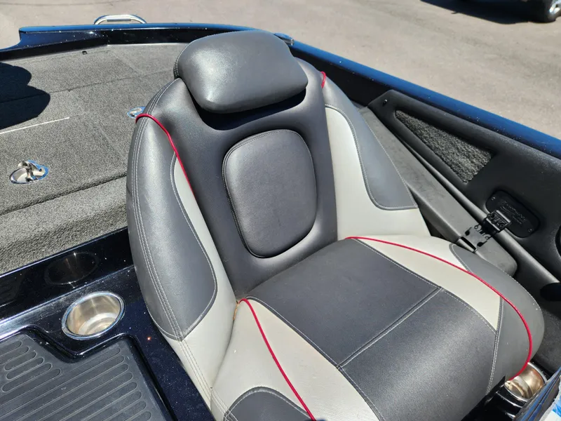 Slide: The Image of 2017 Ranger Z518 boat seat with black and gray upholstery, featuring red accents. - 13