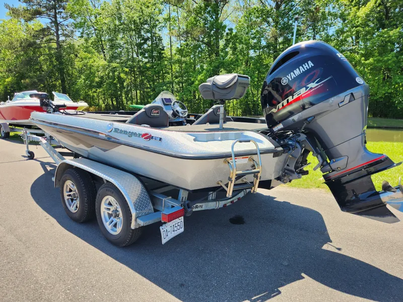 Slide: The Image of 2017 Ranger Z518 boat with Yamaha motor on a trailer, parked on a sunny day. - 2