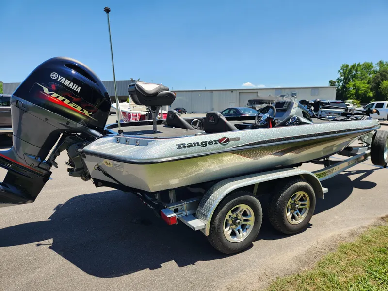 Slide: The Image of 2017 Ranger Z518 boat with Yamaha motor on a trailer, parked outdoors. - 4