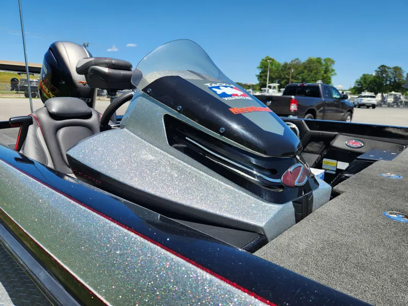 Slide: The Image of 2017 Ranger Z518 boat cockpit with windshield, parked outdoors on a sunny day. - 7