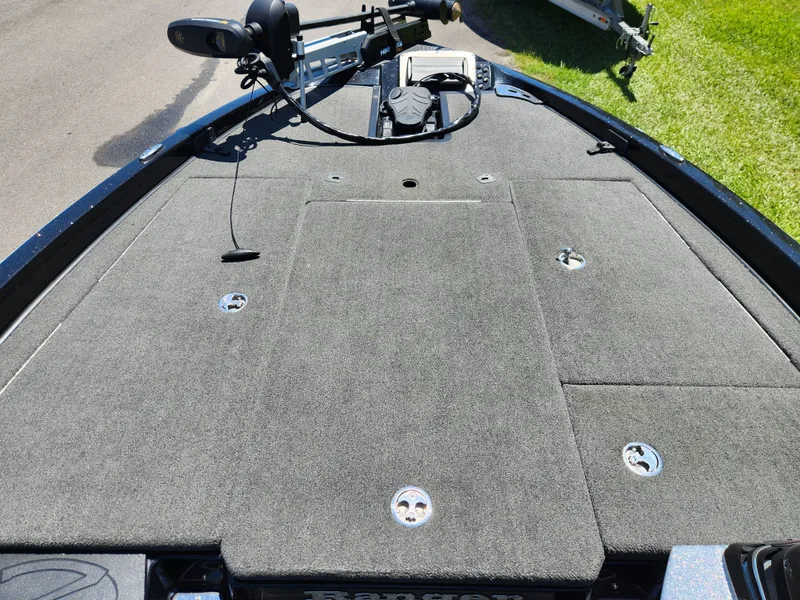 Slide: The Image of 2017 Ranger Z518 boat deck with carpeted surface and fishing equipment. - 9