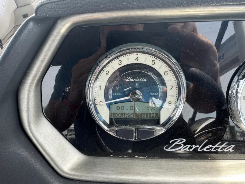 Slide: The Image of Dashboard of 2021 Barletta L25UE showing RPM gauge and hour meter reading 88.0. - 16