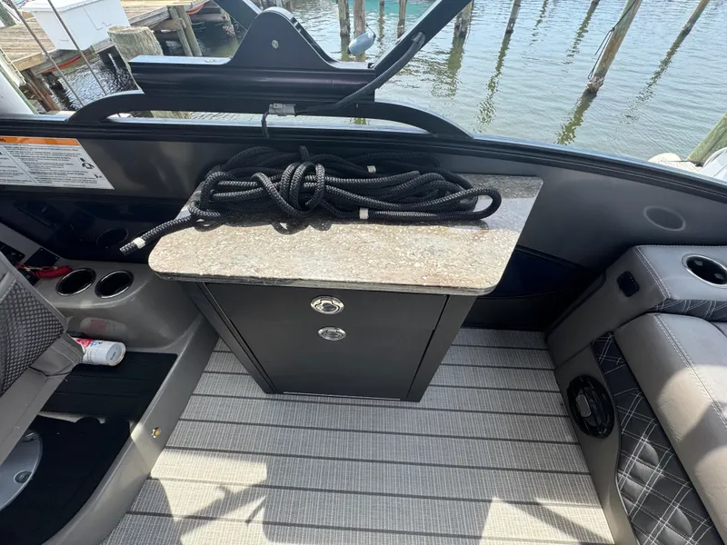 Slide: The Image of 2021 Barletta L25UE boat interior with rope on countertop, near water. - 19