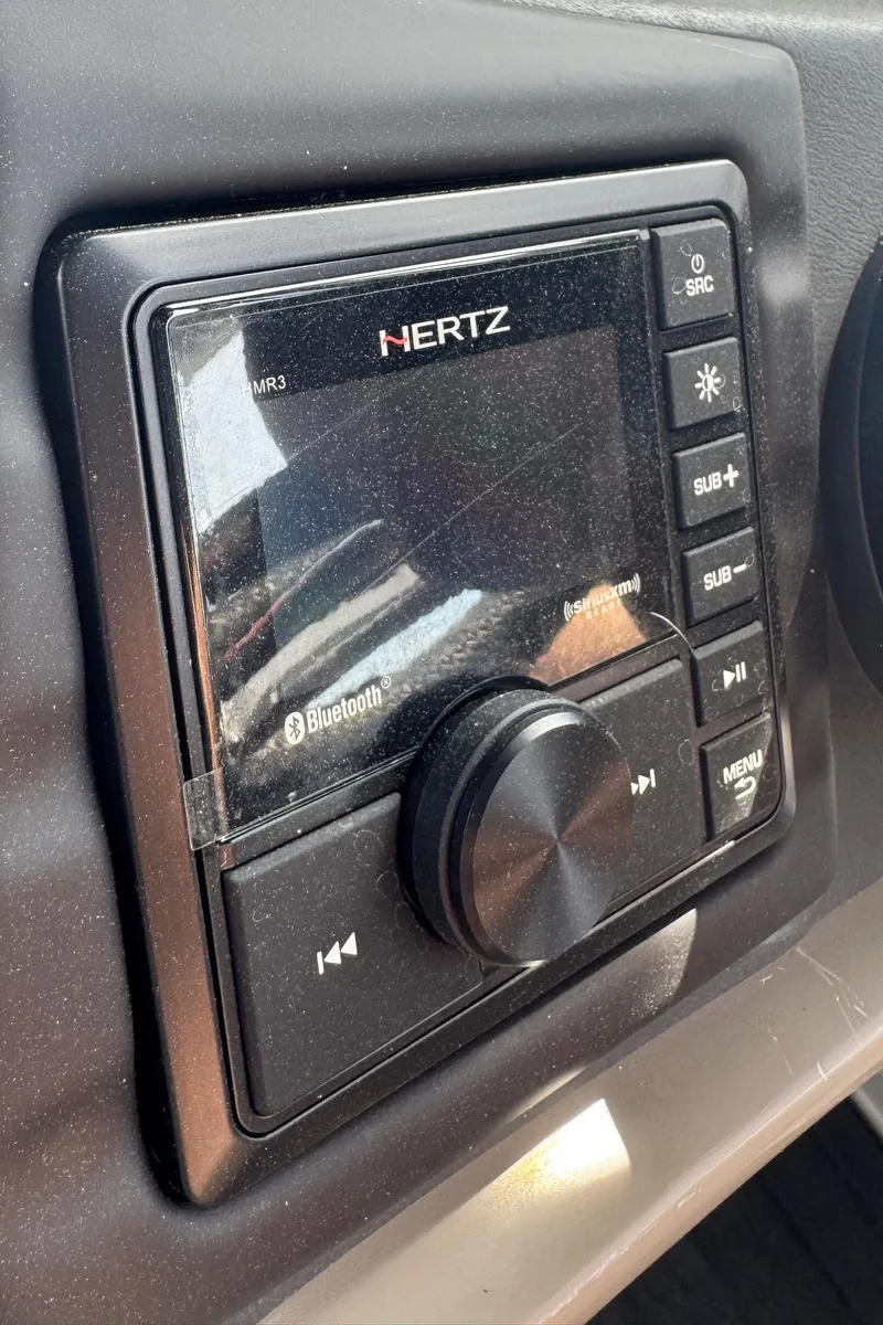 Slide: The Image of Control panel of a 2021 Barletta L25UE boat with Hertz audio system. - 21