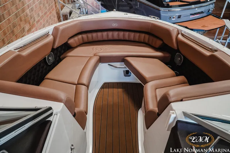 Slide: The Image of Luxurious interior of 2013 Cobalt A28 boat with brown leather seating at Lake Norman Marina. - 18