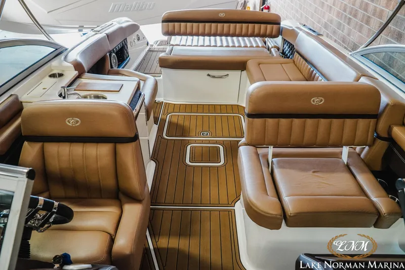 Slide: The Image of Luxurious interior of a 2013 Cobalt A28 boat with tan leather seating. - 20