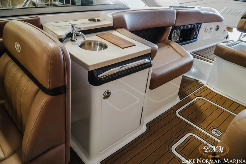 Slide: The Image of Luxurious interior of 2013 Cobalt A28 boat with leather seating and kitchenette. - 22