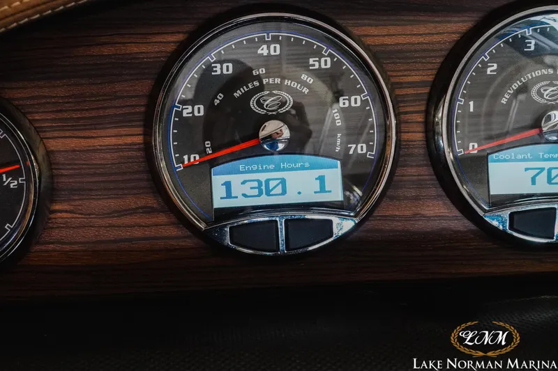 Slide: The Image of Dashboard of a 2013 Cobalt A28 boat showing speedometer and engine hours. - 26