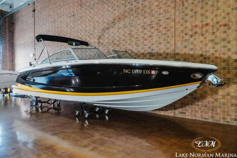 Slide: The Image of 2013 Cobalt A28 boat displayed indoors at Lake Norman Marina. - 3