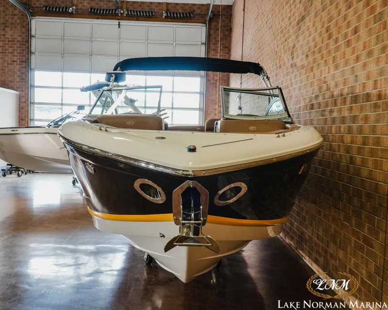 Slide: The Image of 2013 Cobalt A28 boat displayed indoors at Lake Norman Marina. - 4