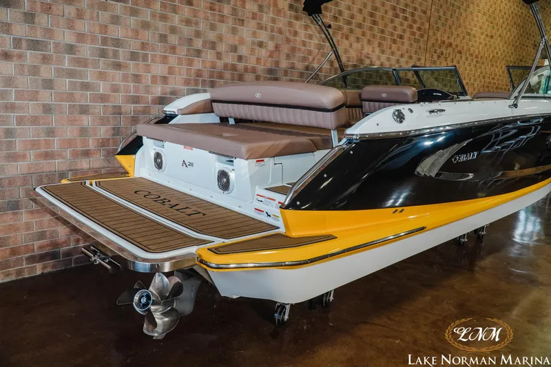 Slide: The Image of 2013 Cobalt A28 boat with yellow accents at Lake Norman Marina. - 6
