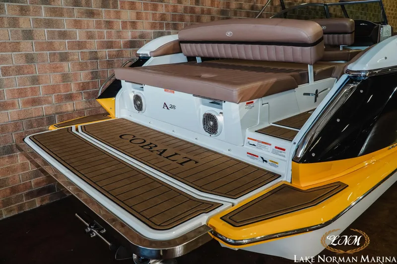 Slide: The Image of 2013 Cobalt A28 boat with teak deck and brown seating at Lake Norman Marina. - 8