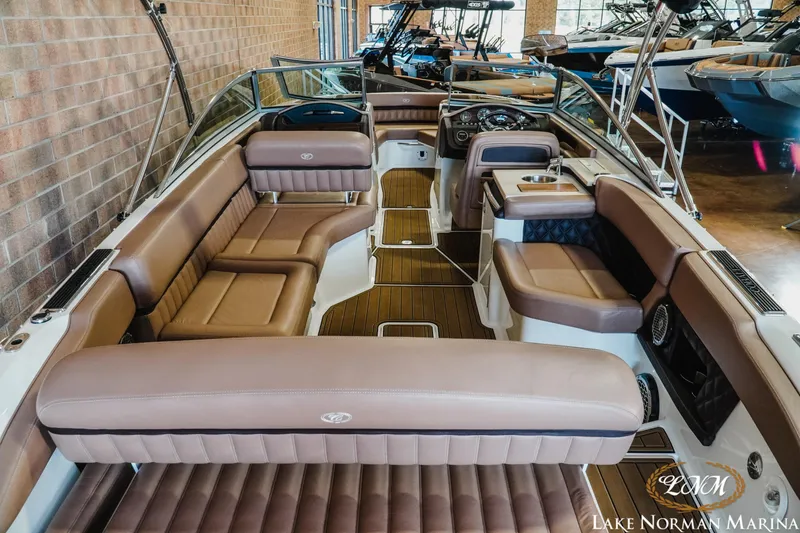 Slide: The Image of 2013 Cobalt A28 boat interior with luxurious brown seating at Lake Norman Marina. - 9