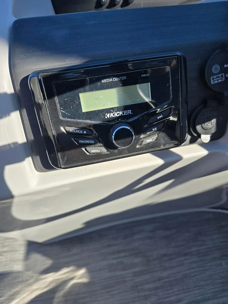 Slide: The Image of Kicker media center on 2023 Bennington 22SXSRC boat dashboard. - 11