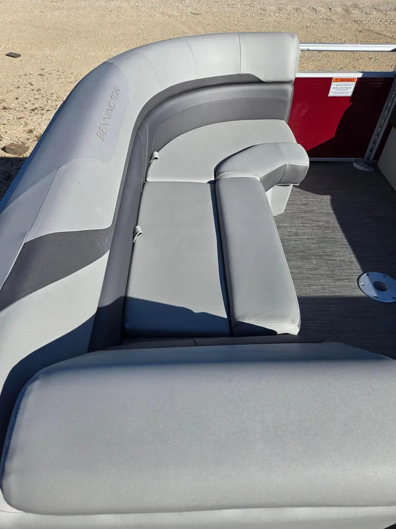 Slide: The Image of 2023 Bennington 22SXSRC boat interior with gray seating and flooring. - 13