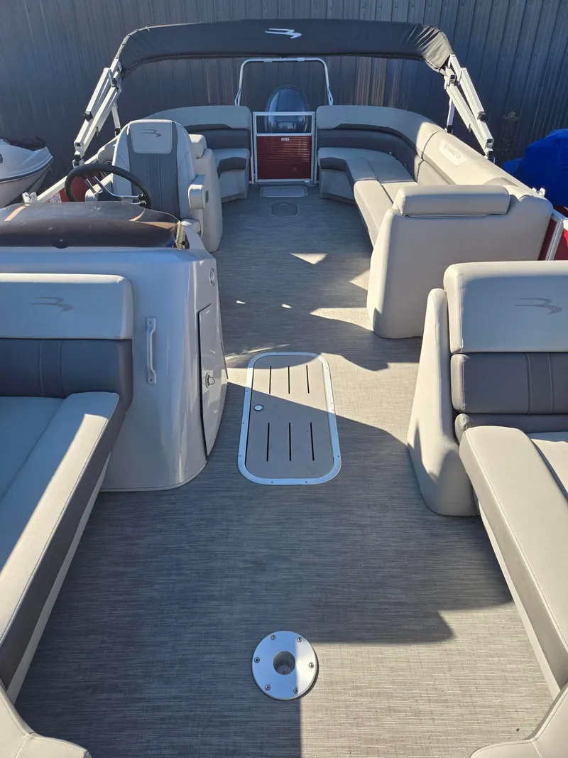 Slide: The Image of 2023 Bennington 22SXSRC pontoon boat interior with spacious seating and modern design. - 15