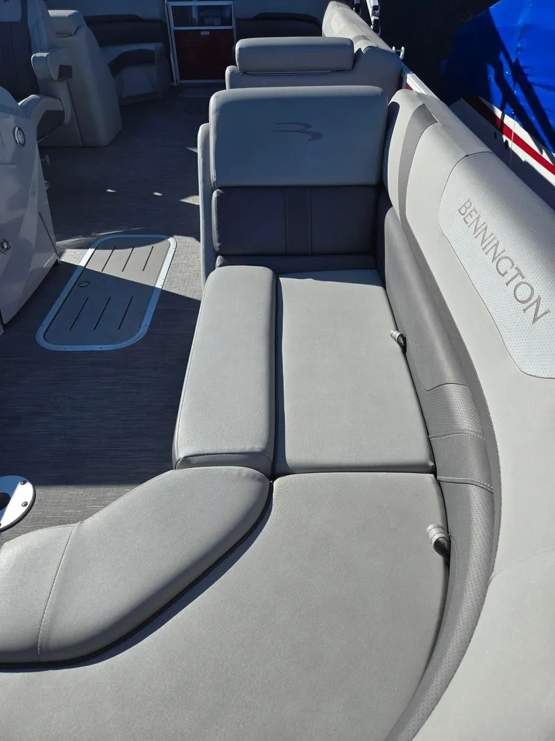 Slide: The Image of 2023 Bennington 22SXSRC boat interior with gray seating and spacious layout. - 17