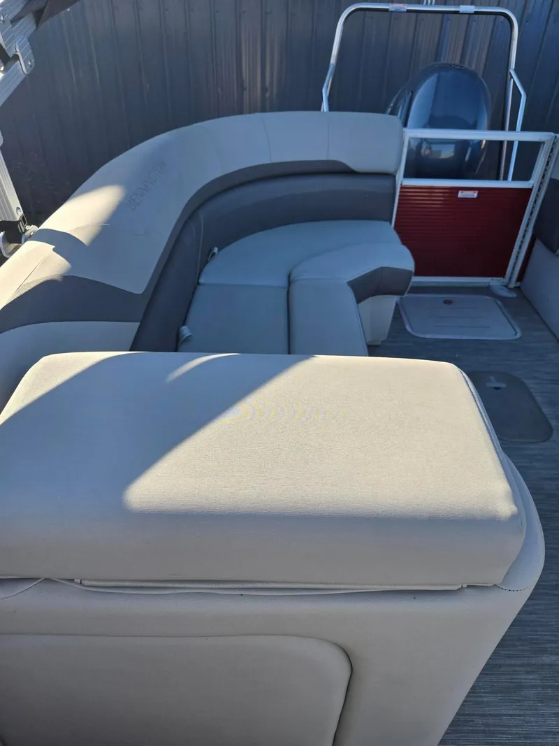 Slide: The Image of 2023 Bennington 22SXSRC pontoon boat interior with plush seating and modern design. - 20