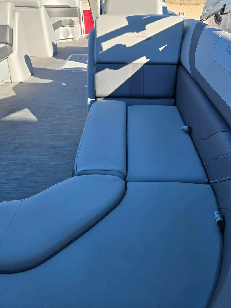 Slide: The Image of 2023 Bennington 22SXSRC boat interior with gray cushioned seating. - 8