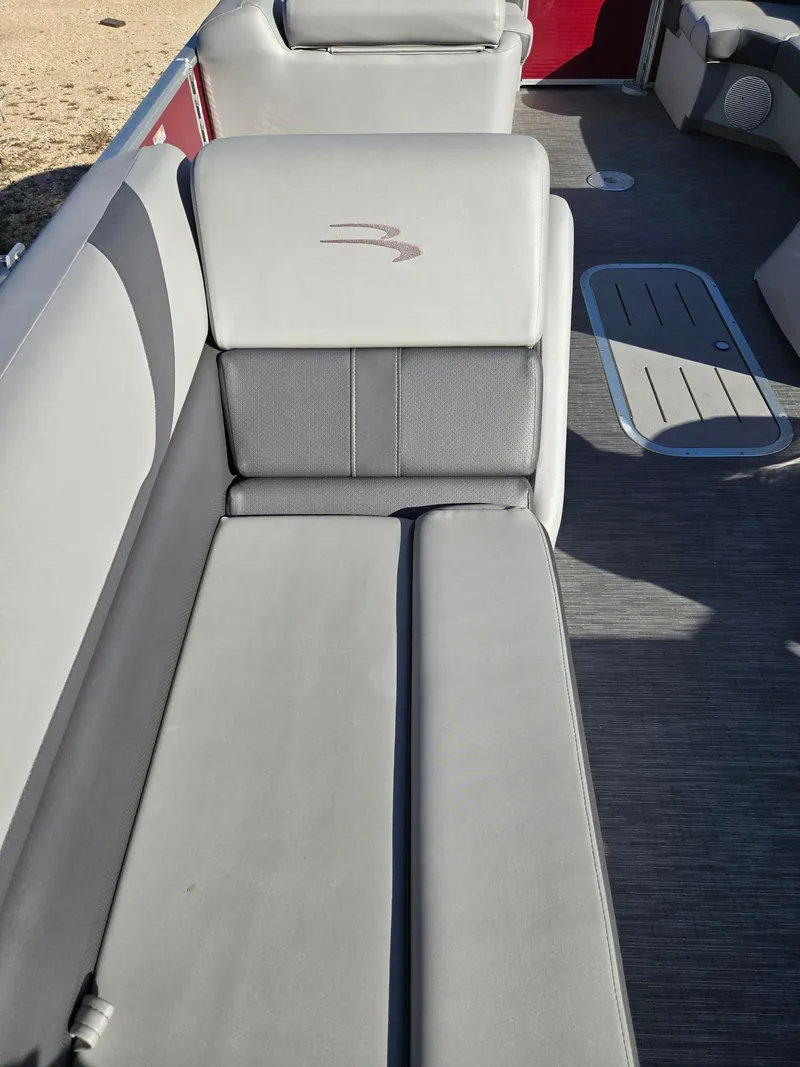 Slide: The Image of 2023 Bennington 22SXSRC boat interior with gray seating and flooring. - 9