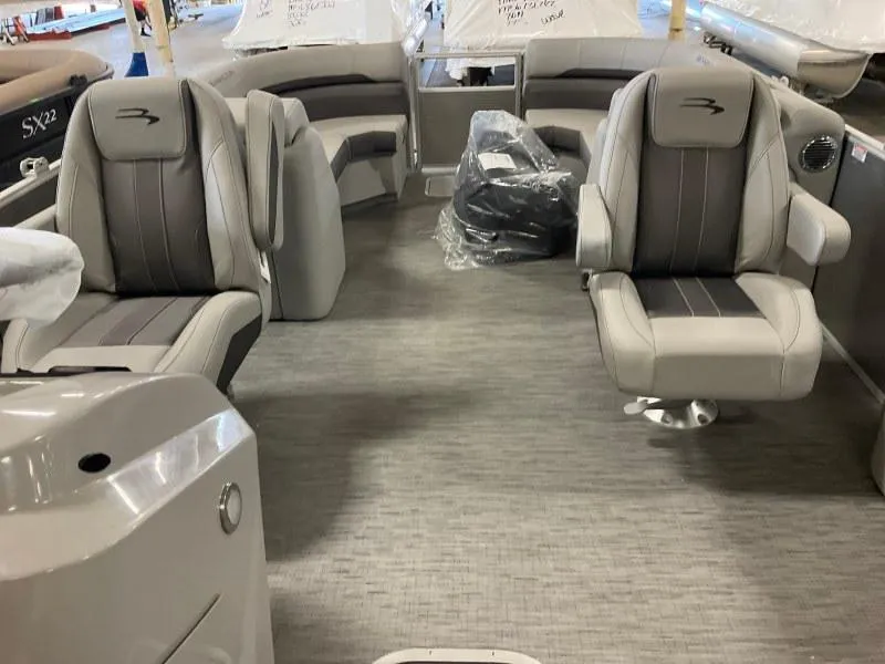 Slide: The Image of 2022 Bennington 23SXSR boat interior with gray seating and modern design. - 4