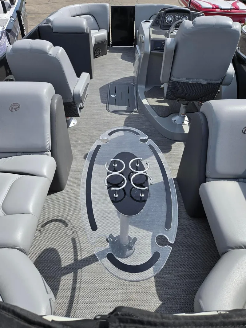 Slide: The Image of 2021 Lowe Retreat 230 High Performance boat interior with gray seating and cup holders. - 15