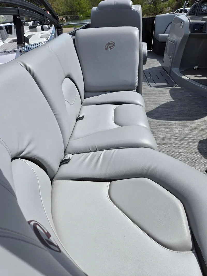 Slide: The Image of 2021 Lowe Retreat 230 High Performance boat with luxurious gray seating. - 16