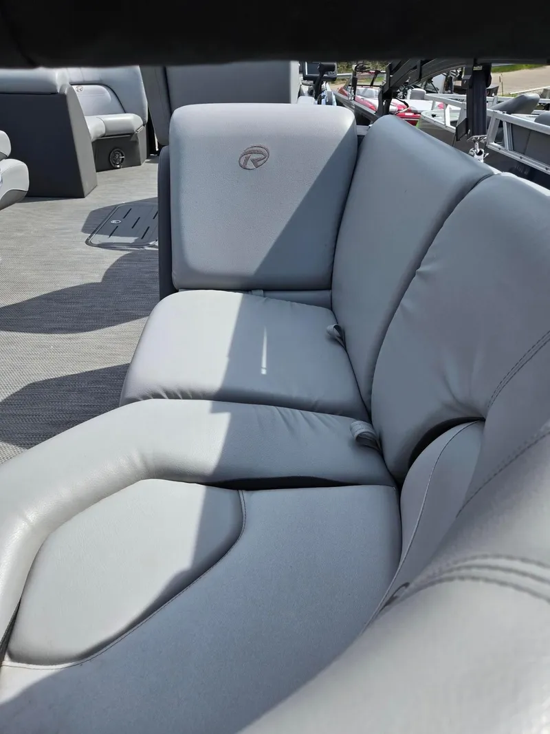 Slide: The Image of 2021 Lowe Retreat 230 High Performance boat with comfortable gray seating. - 17